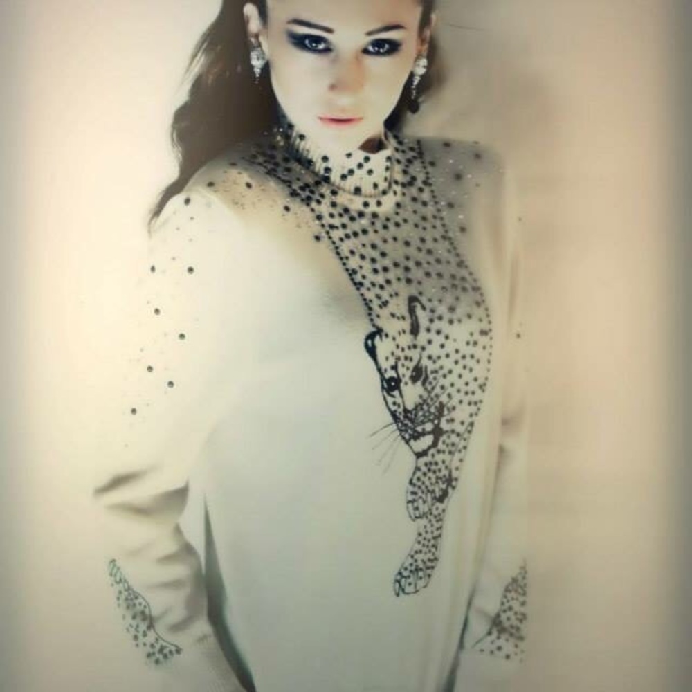 Couture original cougar pull over sweater